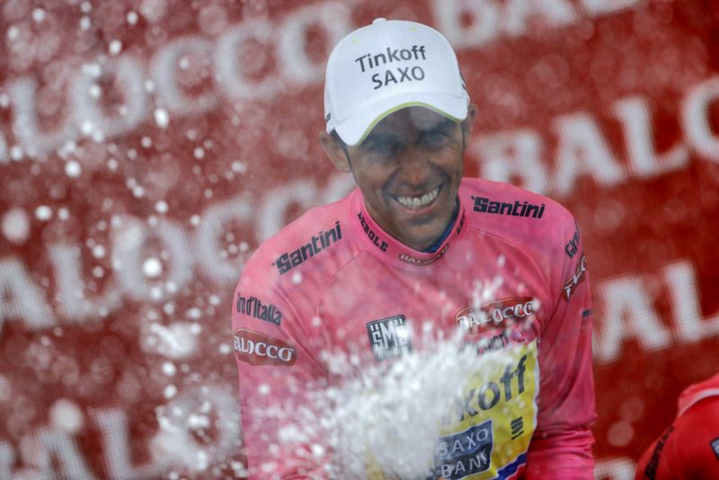 Alberto Contador sprays the prosecco for the first time on the podium today