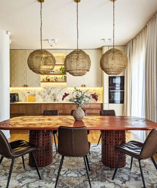 kitchen-diner with wooden table and three pendants