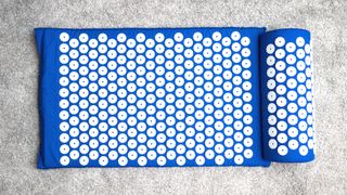 a photo of a bed of nails mat/acupressure mat