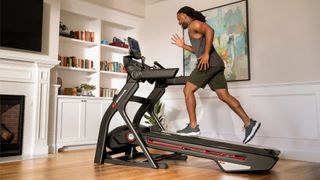 Man running on Bowflex Treadmill 10