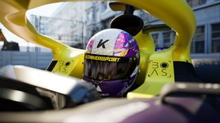 A driver sits in a yellow and purple racer, wearing a helmet that matches its colour scheme