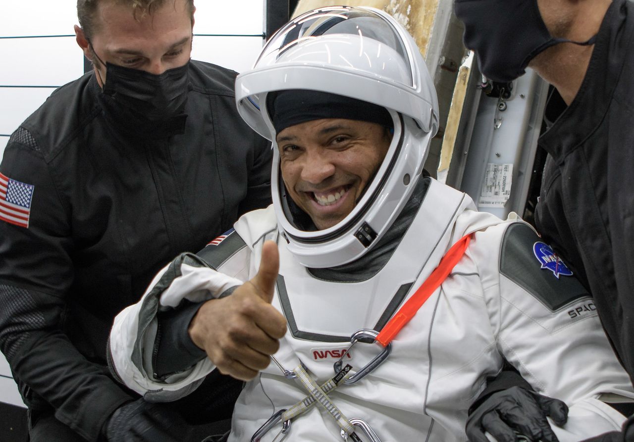 NASA astronaut Victor Glover celebrates after returning to Earth on SpaceX's Crew-1 Crew Dragon capsule Resilience with a splashdown in the Gulf of Mexico near Panama City, Florida on May 2, 2021.