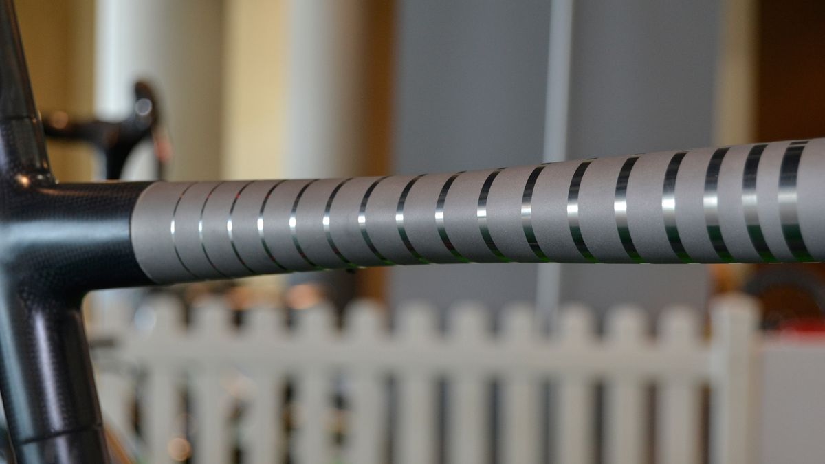 The top tube is pinched to encourage it to flex in a specific way to increase comfort without detracting from the performance