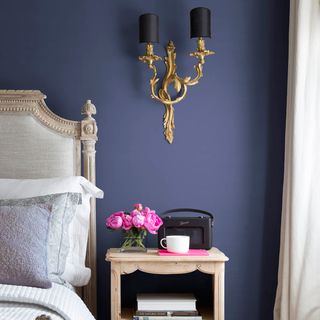 room with purple wall and side table