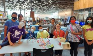 Kids posing with creations