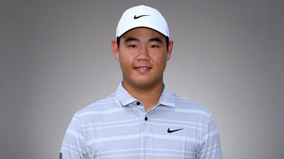 Tom Kim poses for a PGA Tour headshot photo
