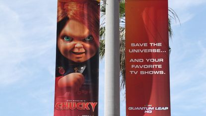 A poster with Chucky doll
