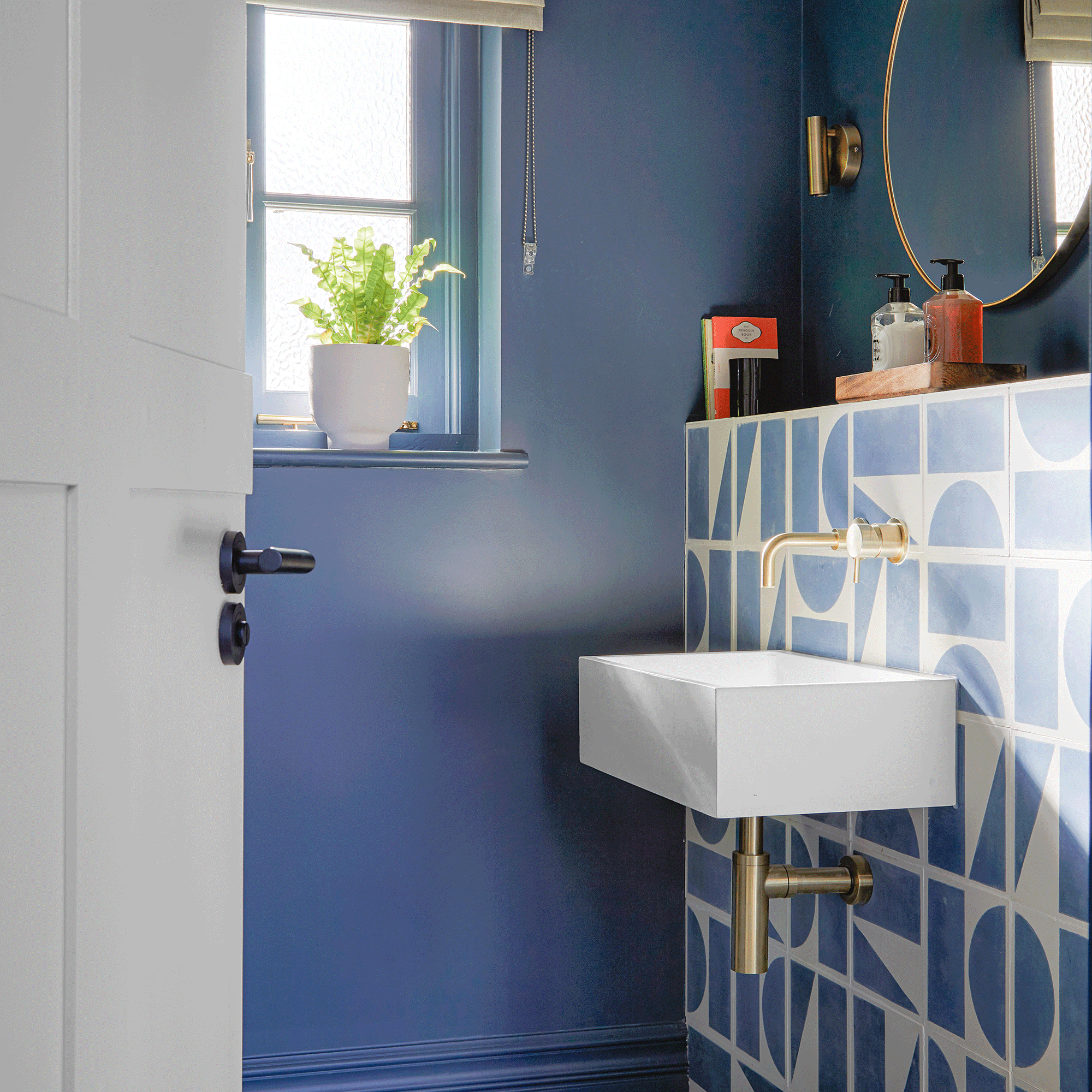 Blue bathroom with large patterned tiles