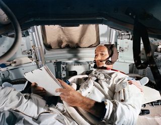 Michael Collins trains in the Command Module simulator at Kennedy Space Center on June 19, 1969.
