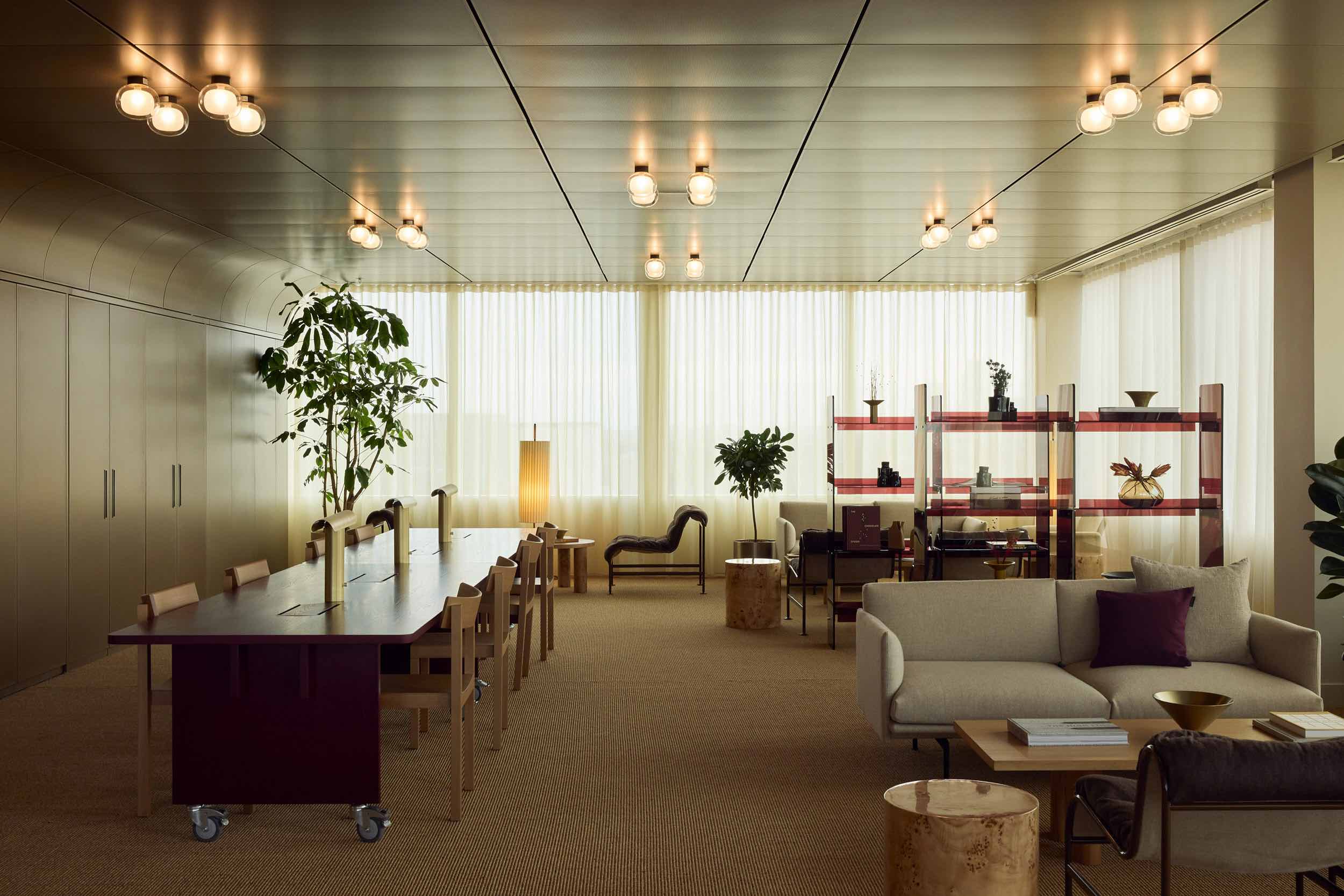 Office interior with beige flooring and sheer drapes