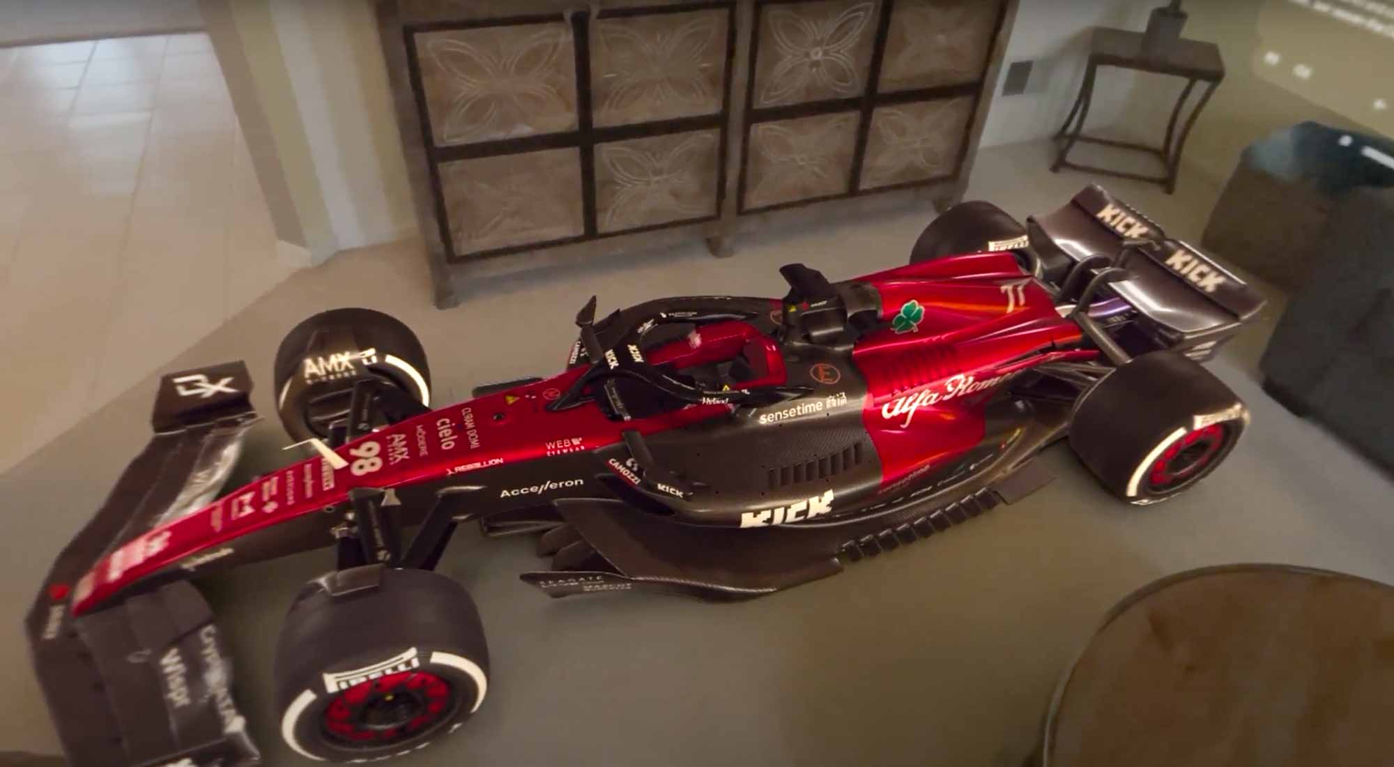 Apple Vision Pro JigSpace app showing 3D model of a Formula One race car in a living room