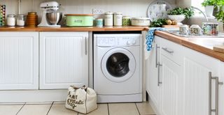 White kitchen with a washing machine