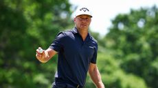 Alex Noren acknowledges the crowd after holing a putt