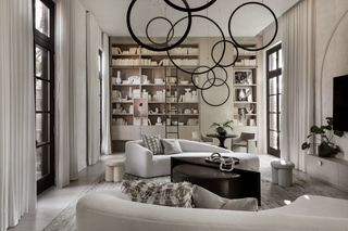 White and black living area with bold chandelier
