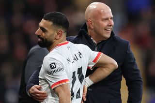 Arne Slot Manager of Liverpool celebrates with Mohamed Salah during the Premier League match between AFC Bournemouth and Liverpool FC at Vitality Stadium on February 01, 2025 in Bournemouth, England.