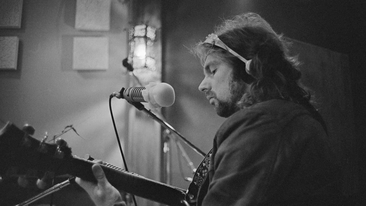 Van Morrison in the studio playing guitar