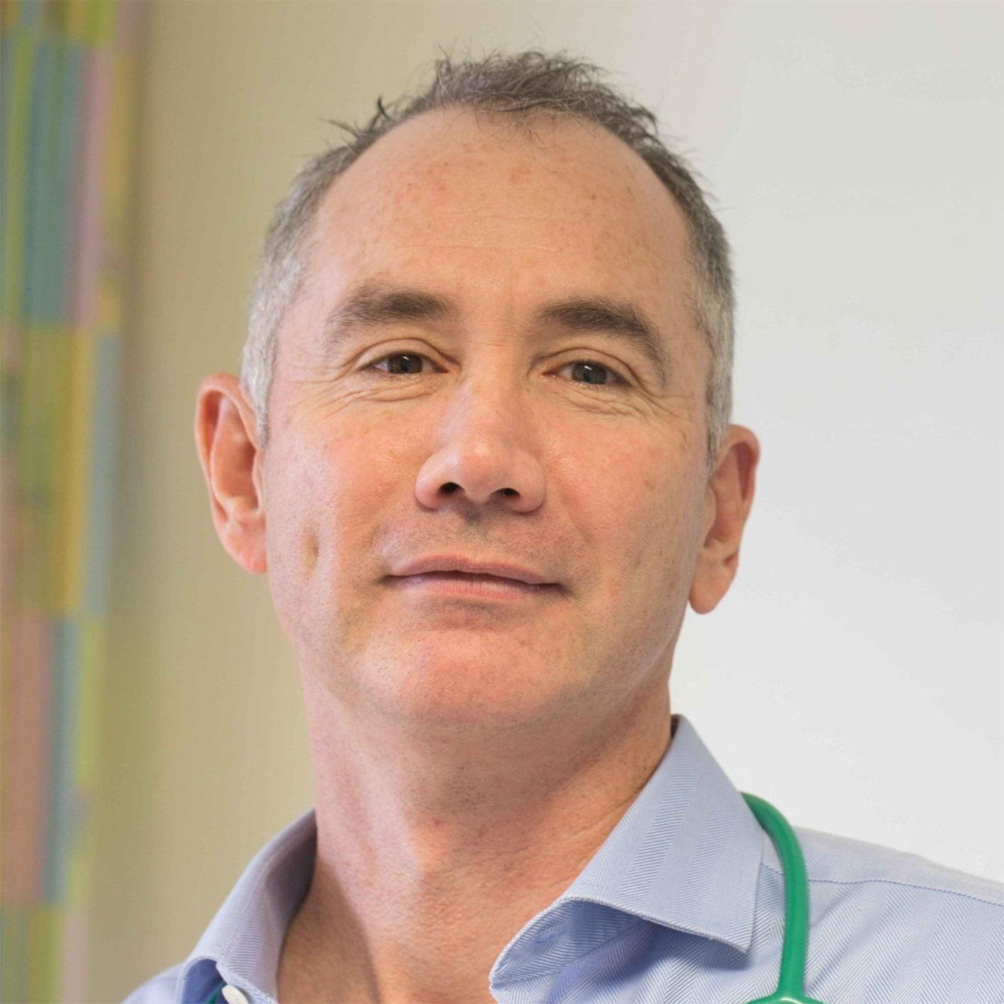 Dr. George Du Toit, a globally renowned allergy professor, dressed in a blue shirt