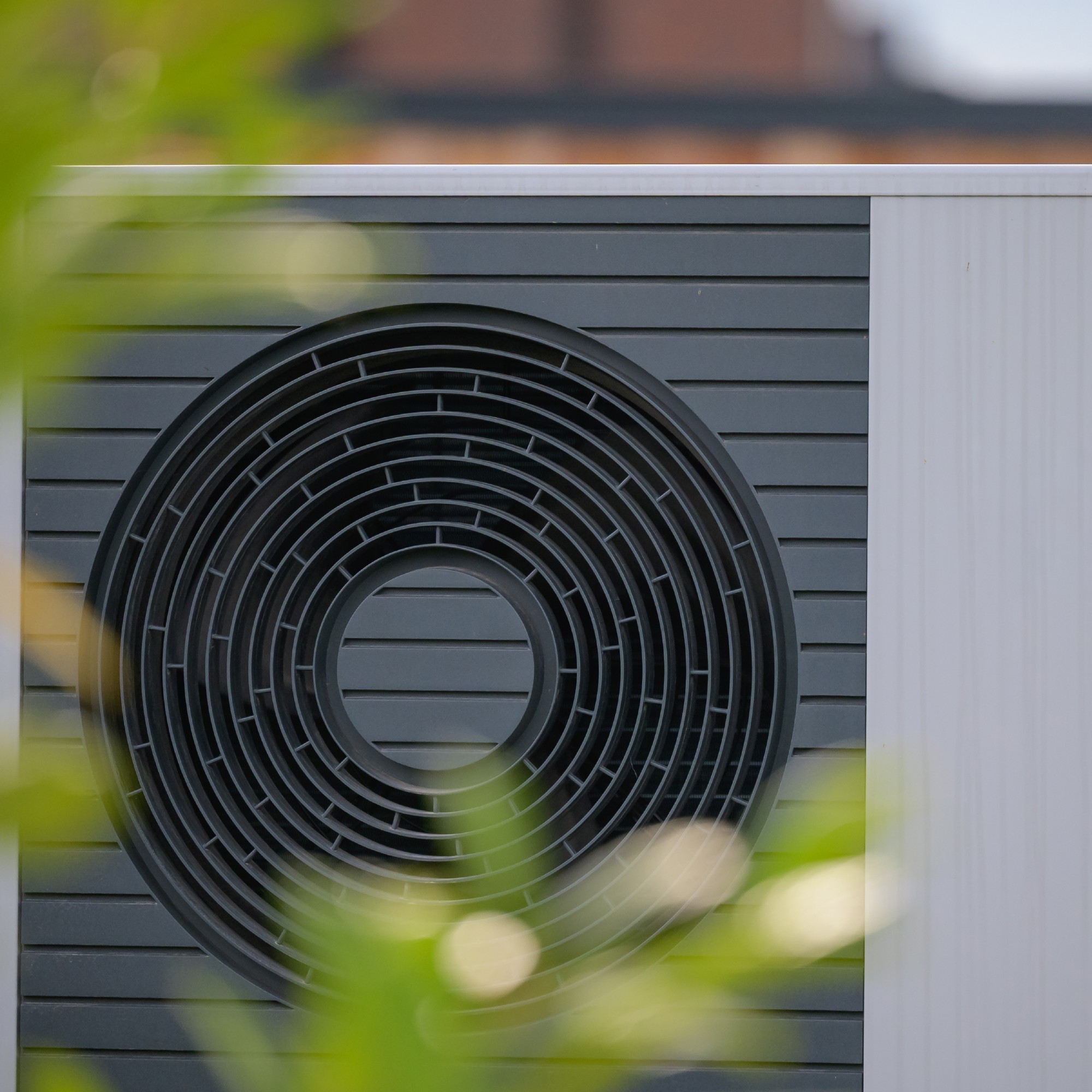 Close up of an air source heat pump installed on house