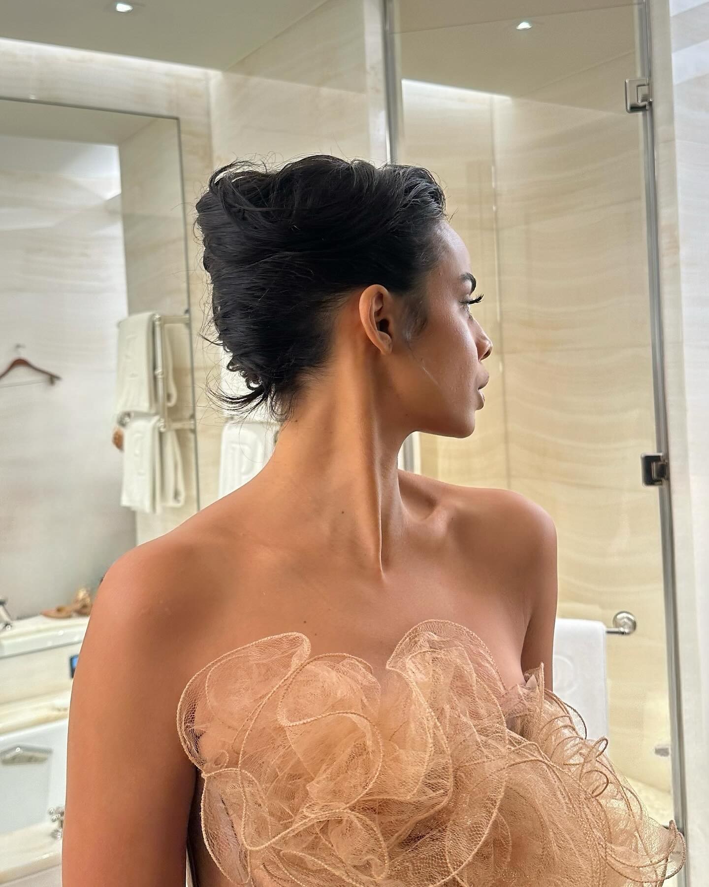 An image of influencer Rochelle Hume showcasing an updo for shoulder-length hair.