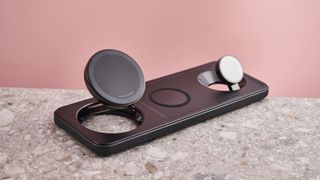 The Anker MagGo Wireless Charging Station 3-in-1 Pad is sitting at an angle on a desk with the iPhone and Apple Watch charging pads extended.