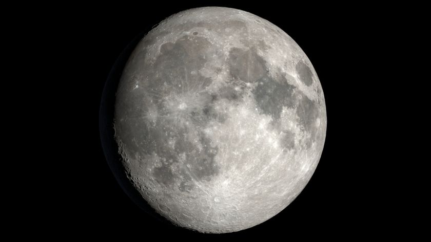 A close up of the moon in space, with various features like lunar seas and craters labeled and designated