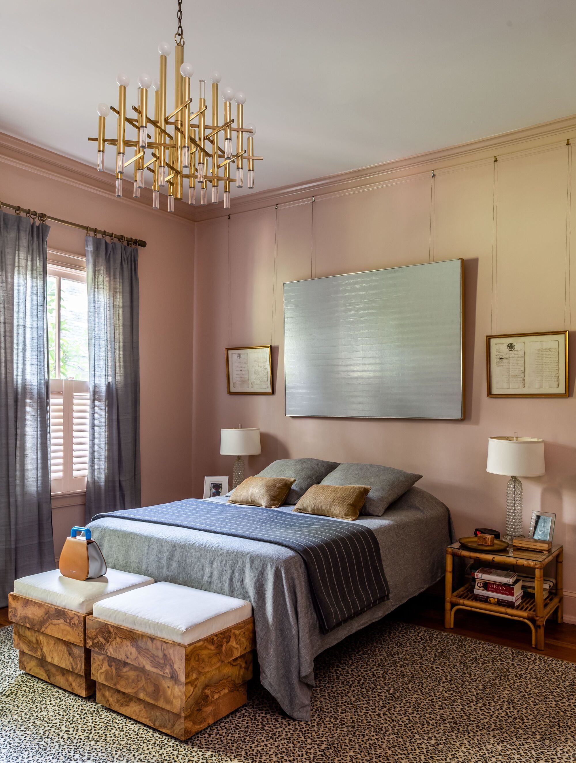 Laura W Jenkins designed bedroom in dusky pink with cane furniture