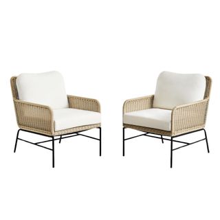 Two outdoor wicker chairs with a white cushion and steel frame/legs