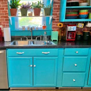 bright blue kitchen units inspired by monica from friends' kitchen