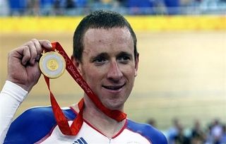 Brad Wiggins proudly shows his medal