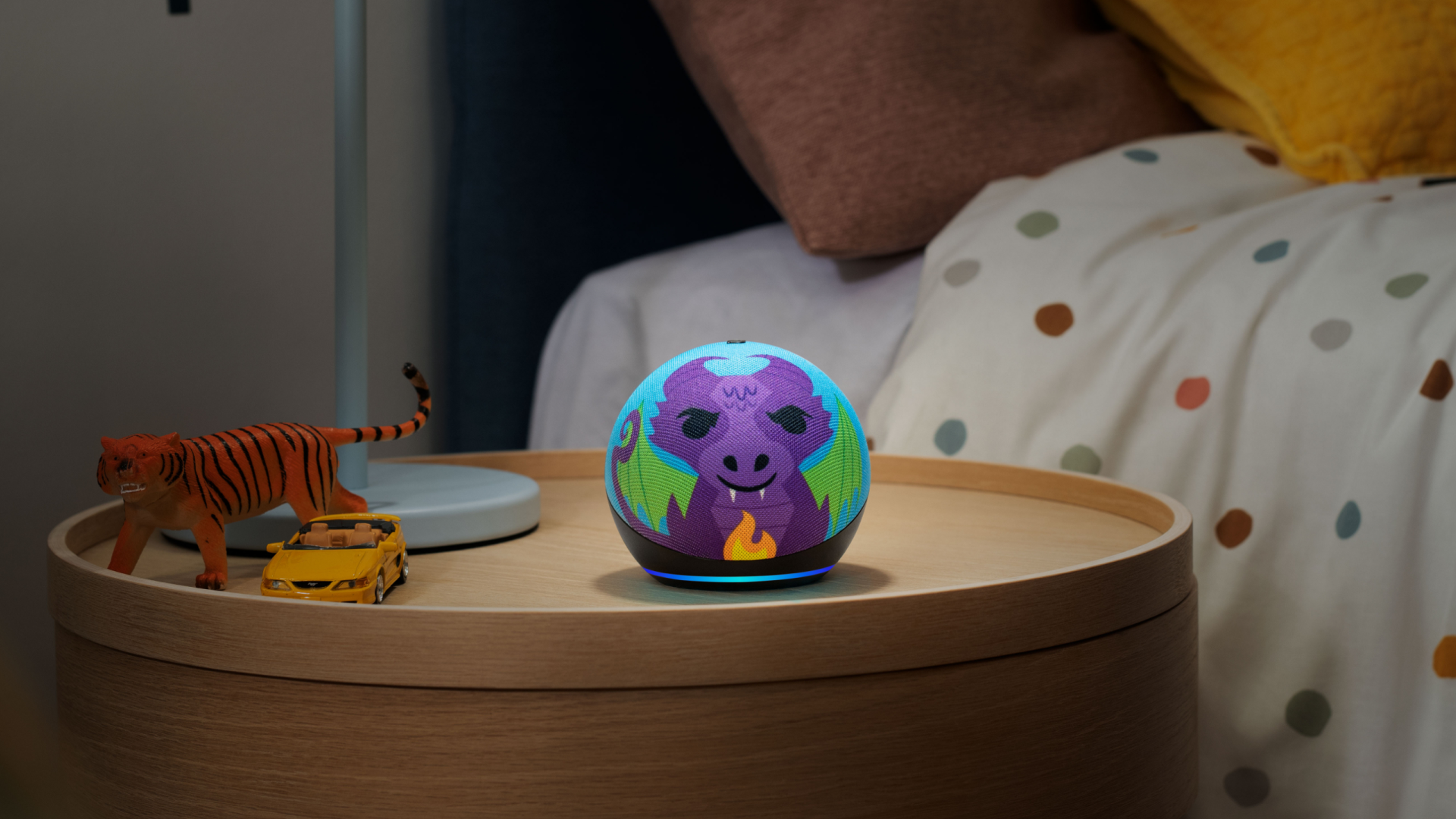 Echo Dot Kids purple dinosaur on bed table