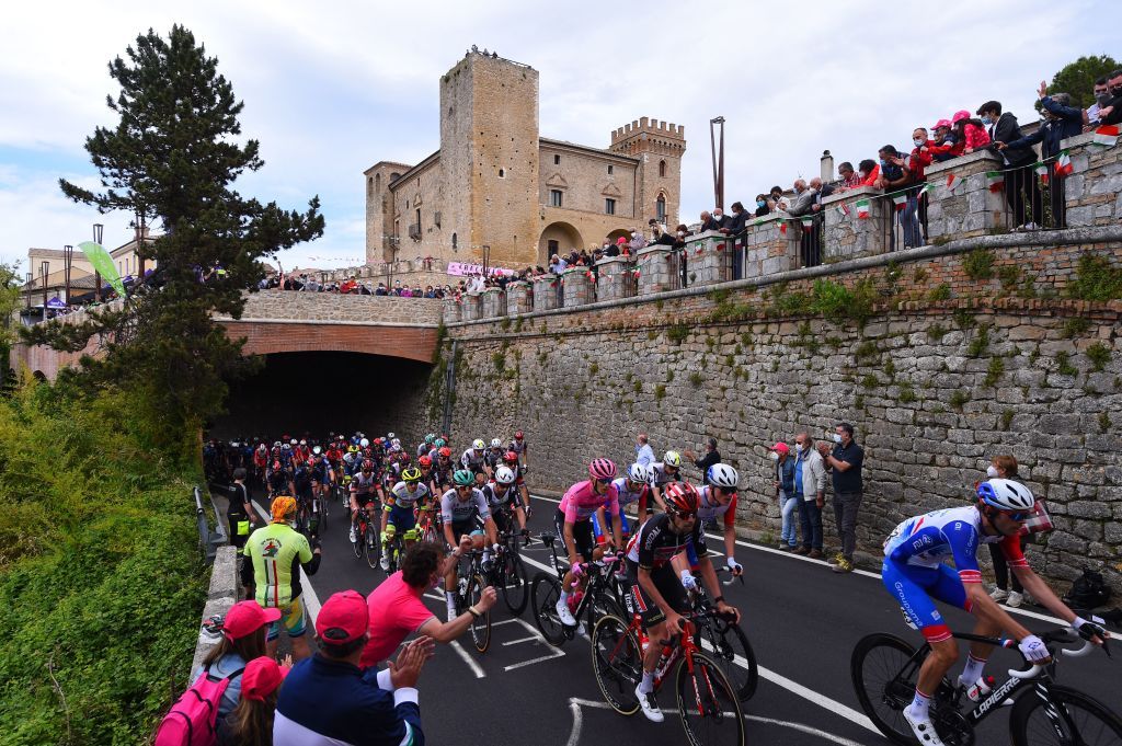 The pack rides past the Ducal Castle of Crecchio during the seventh stage of the Giro dItalia 2021 cycling race 181 km between Notaresco and Termoli on May 14 2021 Photo by Dario BELINGHERI AFP Photo by DARIO BELINGHERIAFP via Getty Images