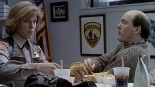 Frances McDormand and John Carroll Lynch eating take-out in Fargo