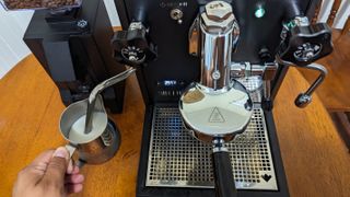 using the steam wand with the Seattle Coffee Gear Diletta Bello+ Espresso Machine on a table