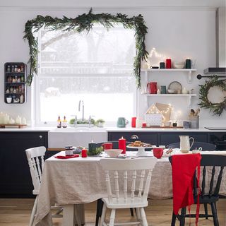 Kitchen with Christmas garland draped around the window