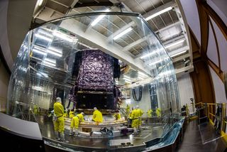 The James Webb Space Telescope was secured to its Ariane 5 rocket on Dec. 11, 2021, inside a "shower curtain" that created a clean room for the operation.