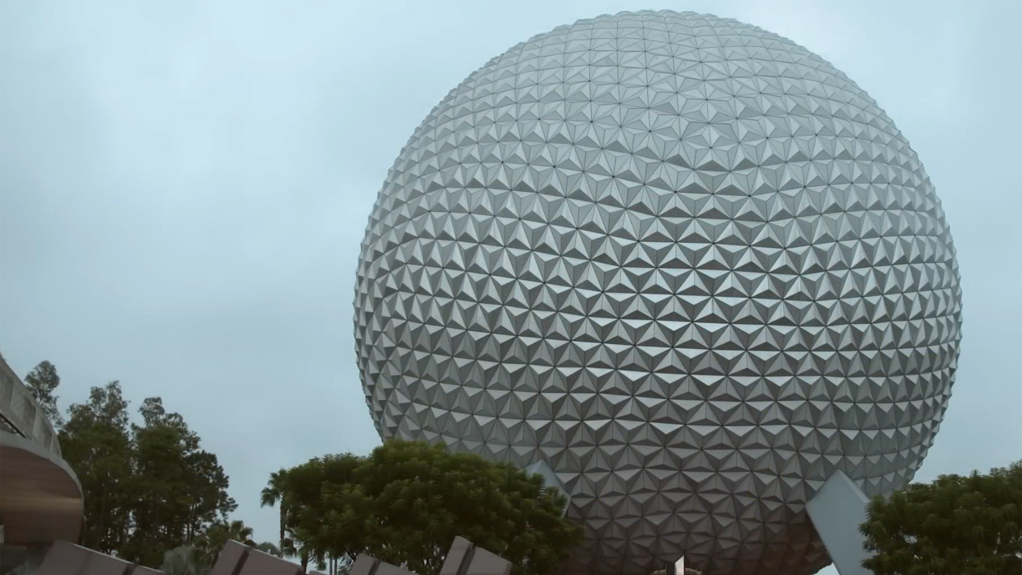 A screenshot of day breaking over the Epcot ball at Walt Disney World.