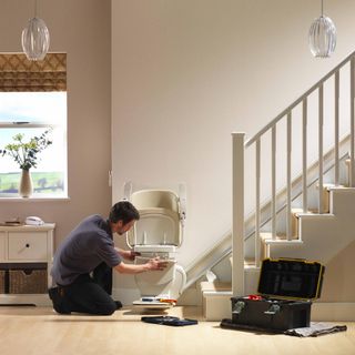 an engineer installing a stairlift