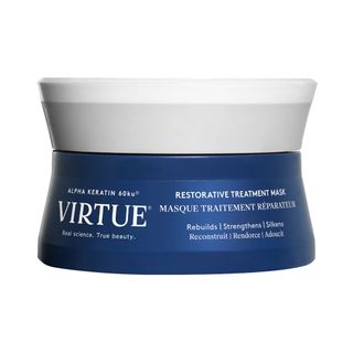 A new, unopened jar of Restorative, Hydrating Treatment Hair Mask With Keratin against a white background.