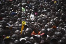 Supporters of the Kenyan opposition watch its leader Raila Odinga's 'swearing-in' ceremony in Nairobi.