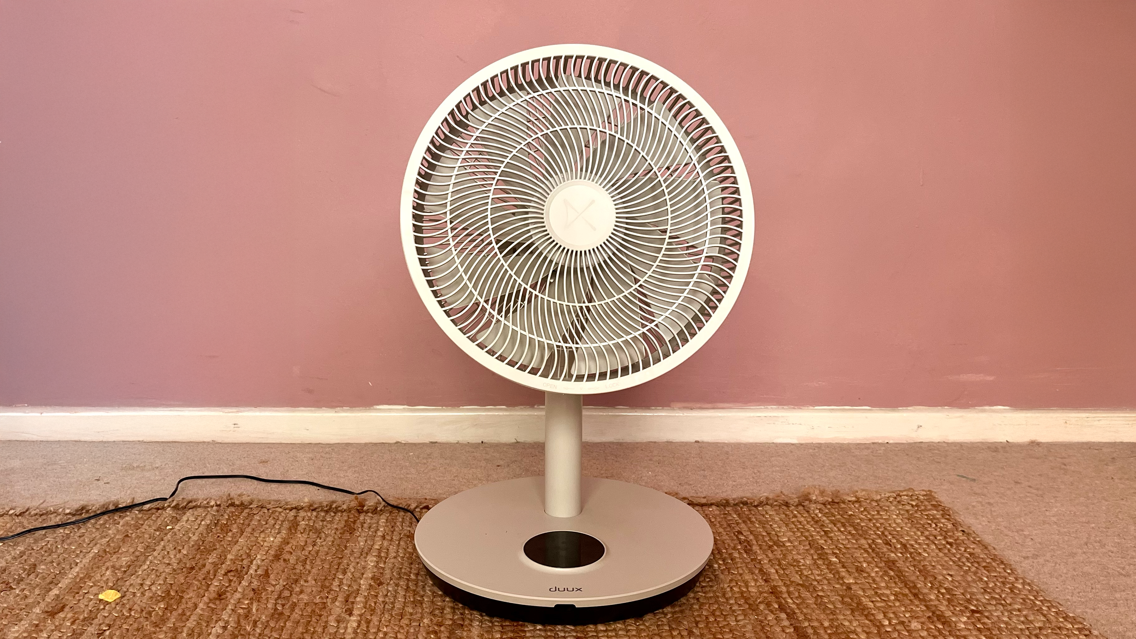 Duux Whisper Flex 2 fan on a pink background