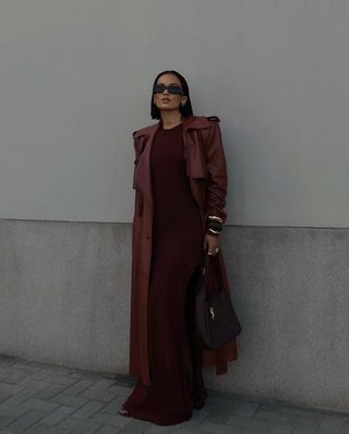 woman in maroon coat and dress