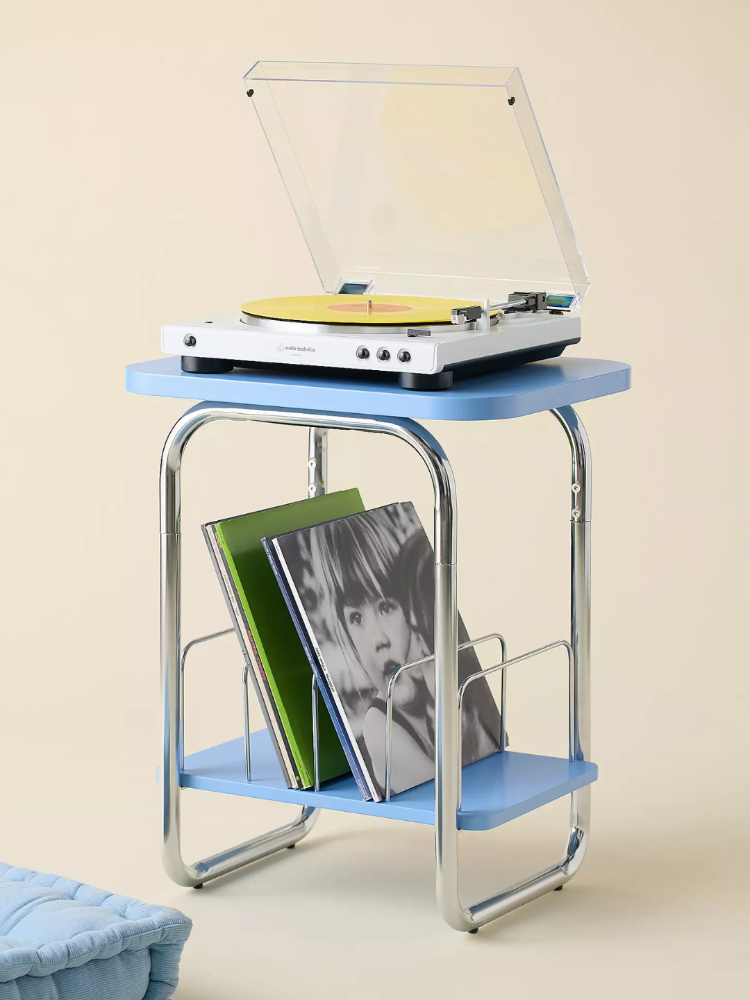 A blue vinyl storage table