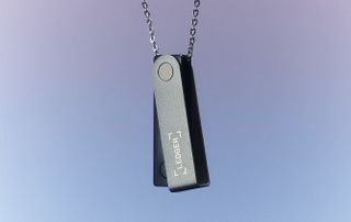 A Ledger hardware wallet on a chain