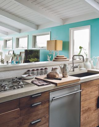 A kitchen with beige granite counter