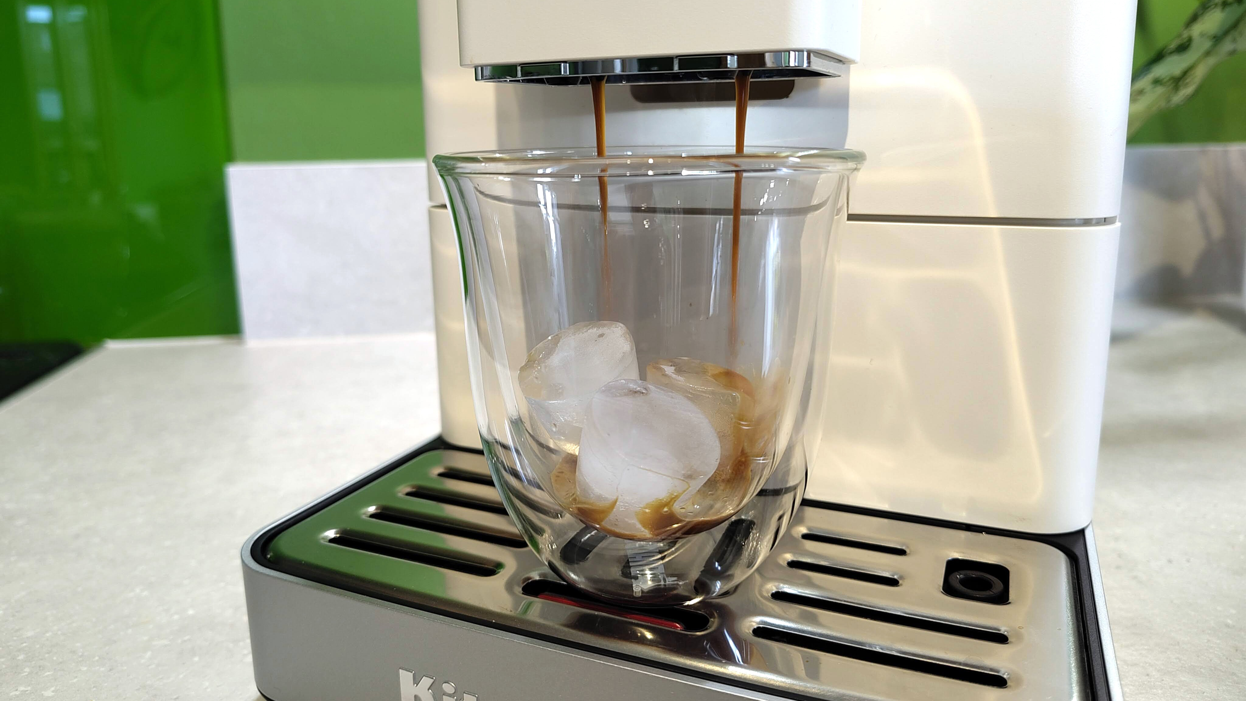 KitchenAid KF4 espresso machine dispensing iced coffee