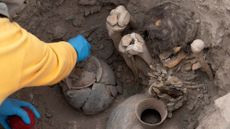 A burial chamber in Peru containing mummies and artifacts. 