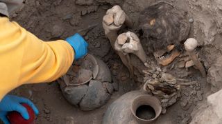 A burial chamber in Peru containing mummies and artifacts. 