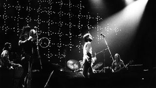 Eric Clapton performs live on stage at Ahoy, Rotterdam on November 30 1974. L-R George Terry (guitar) Yvonne Elliman (backing vocals) Jamie Oldaker (drums) Eric Clapton (guitar) Carl Radle (bass)