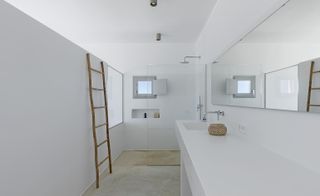 Clean white bathroom interior at KITE House in Greece