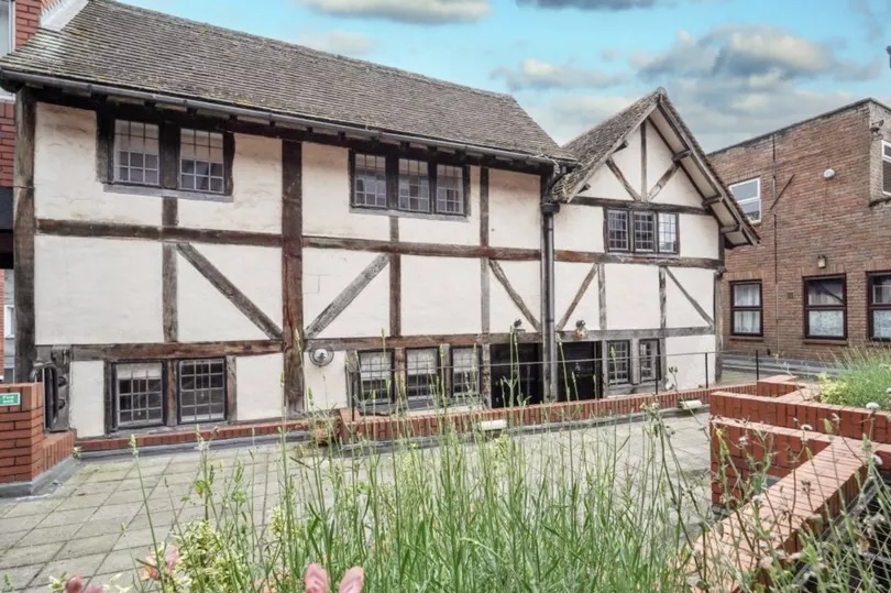 Tudor-style house with mullioned windows